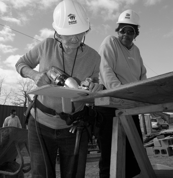 Two alumni at work